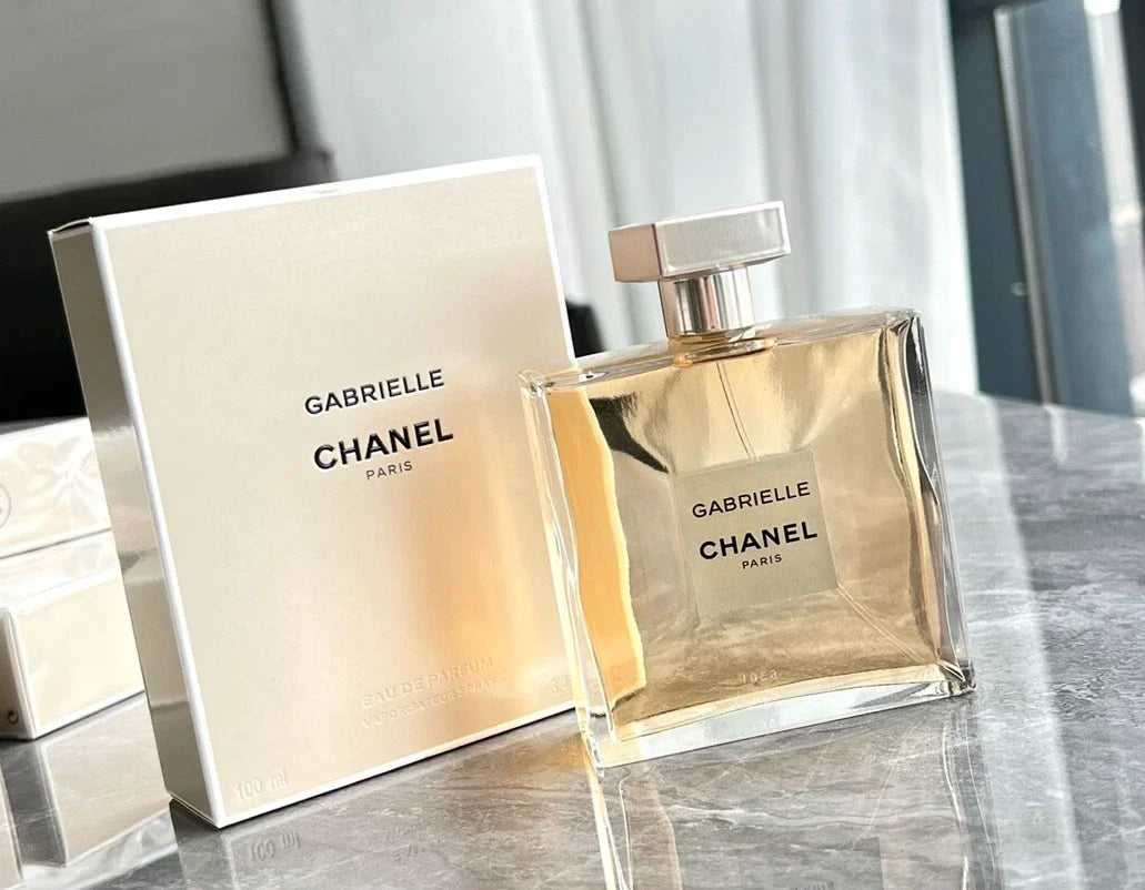 Chanel perfume bottle and packaging on a gray marble surface